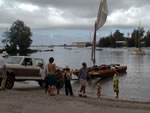 pulling the double canoe out of Hilo Bay